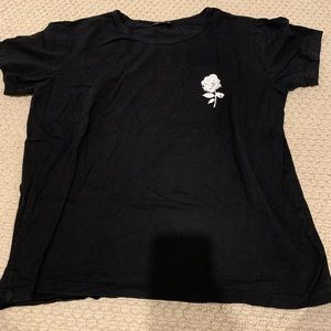 Black shirt with small white rose